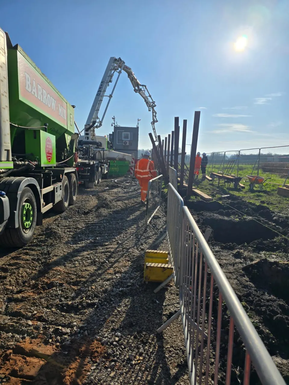 Barrow Mix boom pump filling fence post holes in Skelmersdale