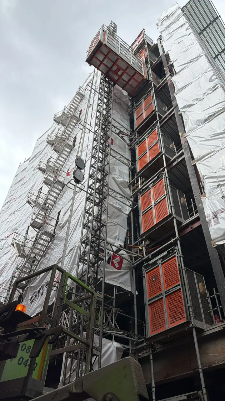 Barrow Mix supplying concrete at a multi-storey new build in Deansgate, with the external hoist running up the scaffolded tower