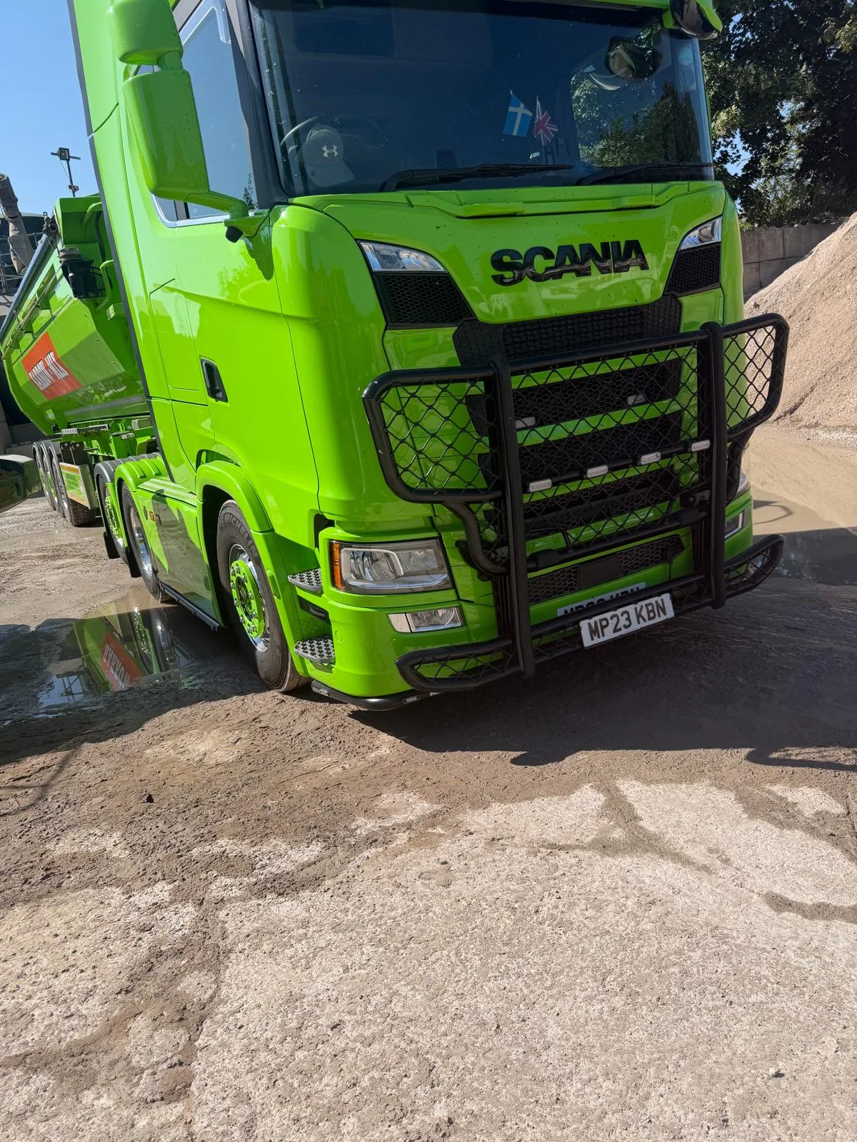 Front of the green Barrow Mix Scania tractor unit