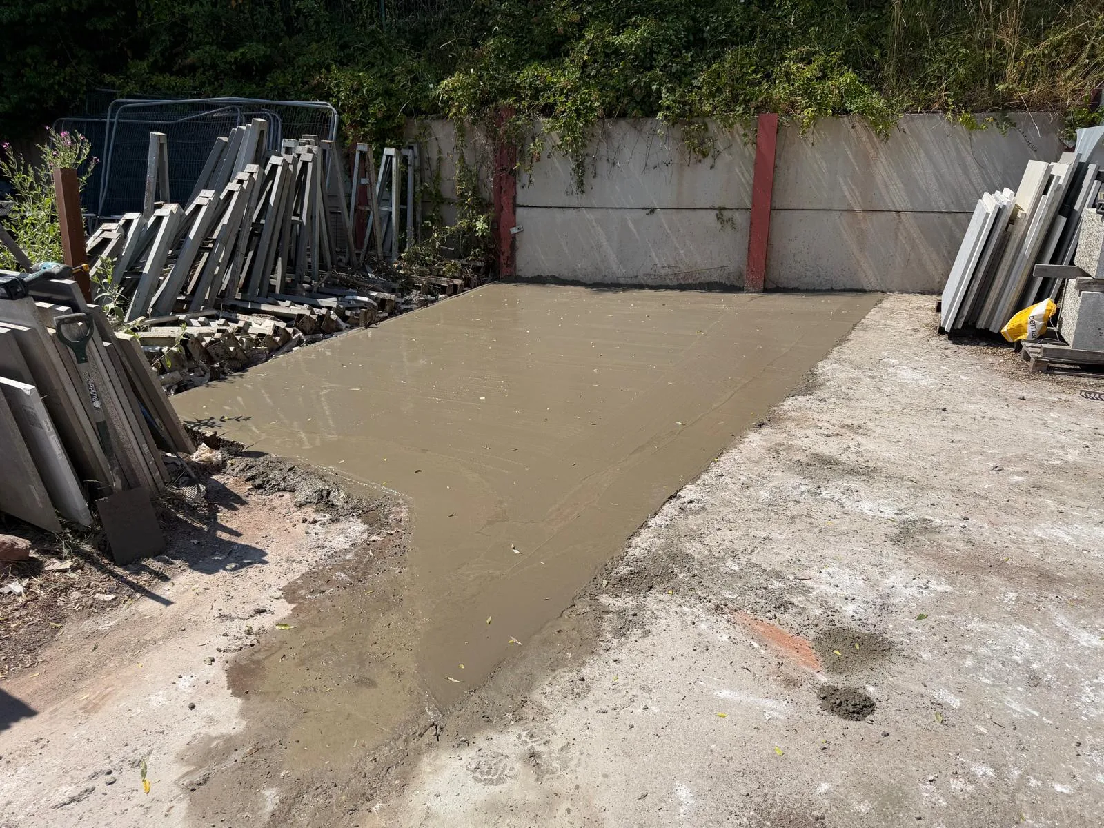Fresh concrete poured for a base at Michael's Marble