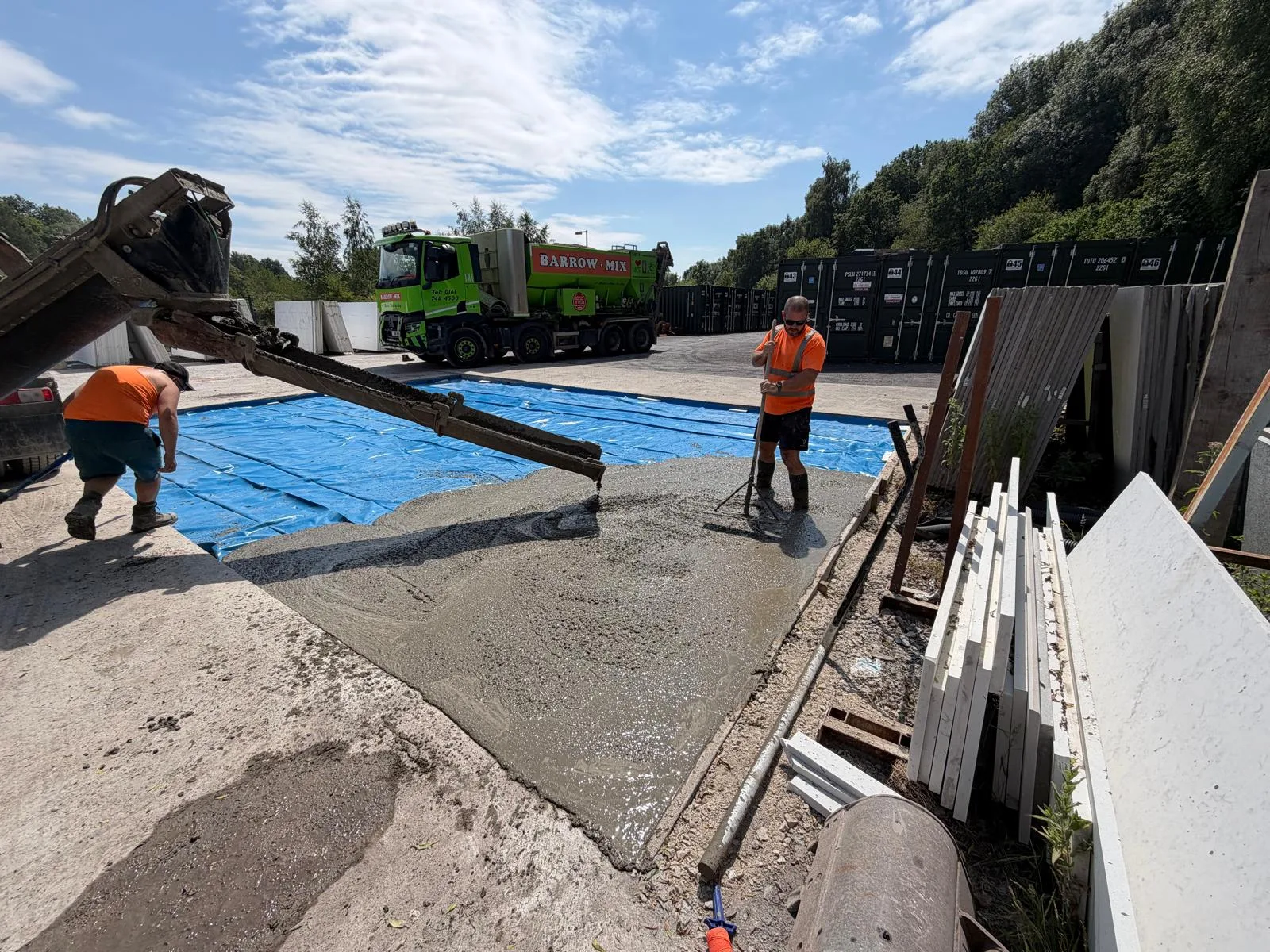 Concrete slab at Michael's Marble stone yard with stacked slabs