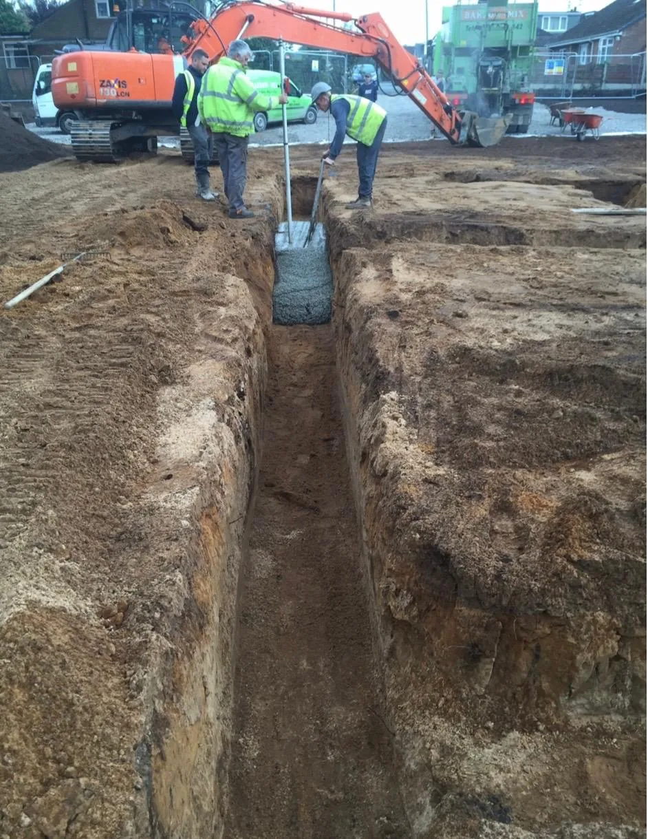 Barrow Mix pouring concrete into the footing trenches at the Lymm new-build