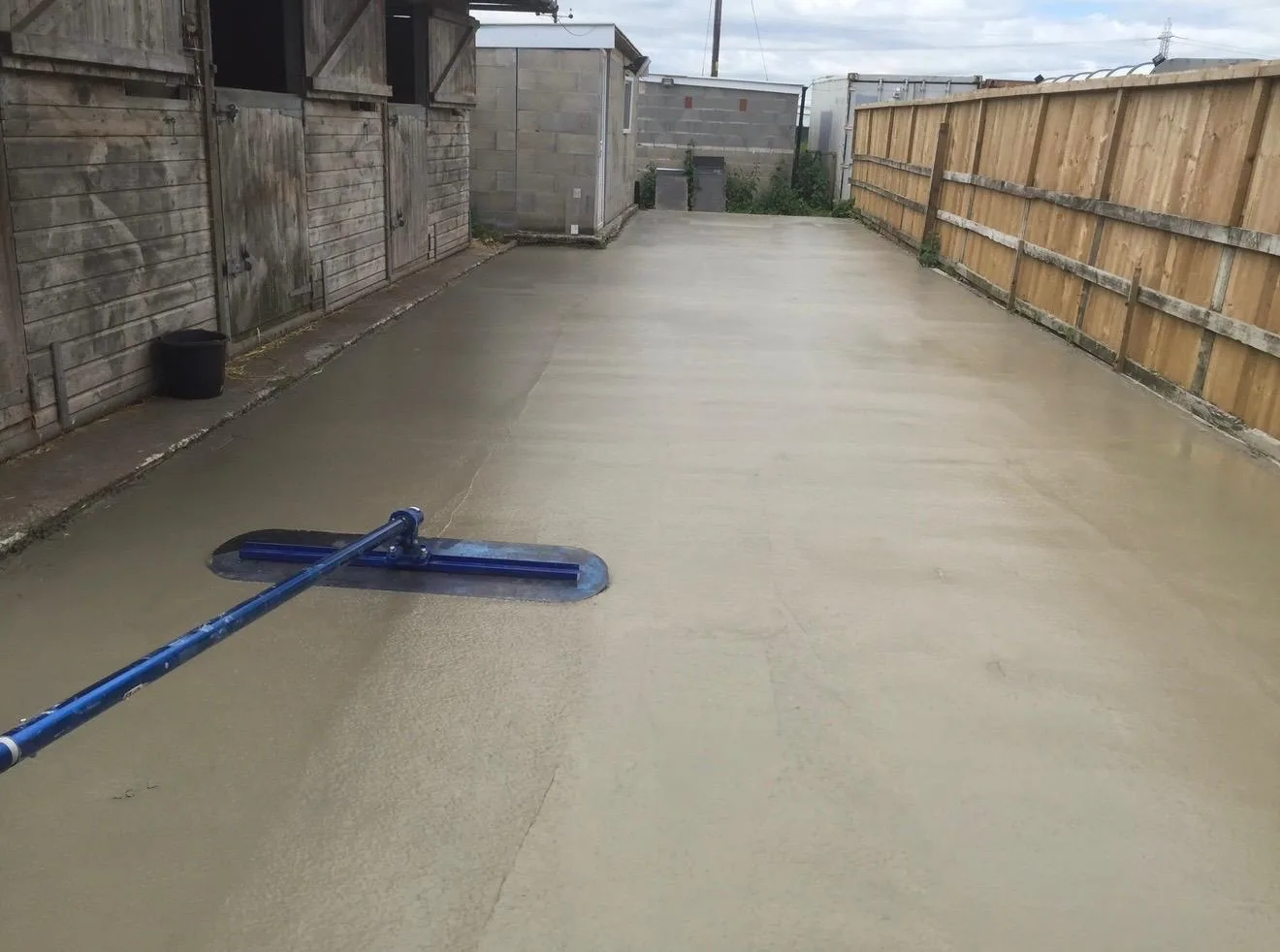 A smooth, hard-wearing concrete dog run floated off at the kennels