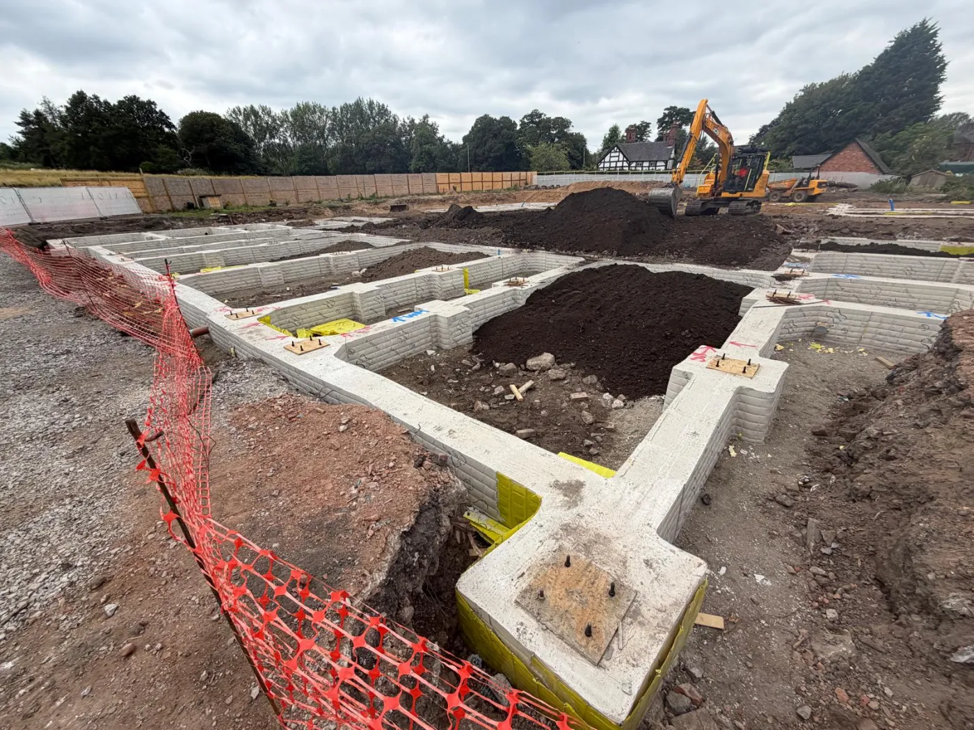 New-build housing foundations poured by Barrow Mix at the Calore Homes site in Thelwall, Warrington
