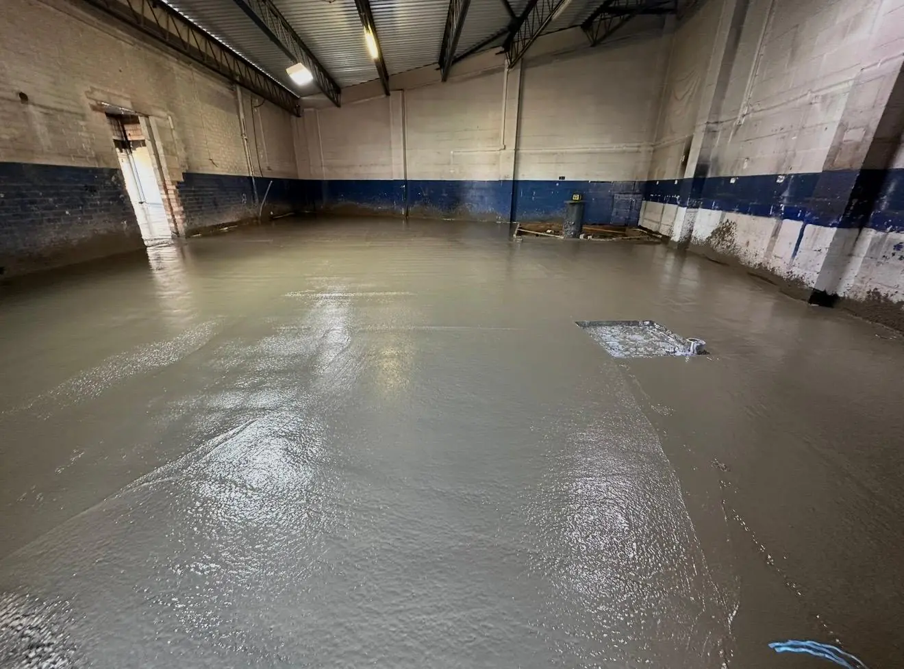 Freshly pumped concrete floor across the Tesco Express unit in Cadishead