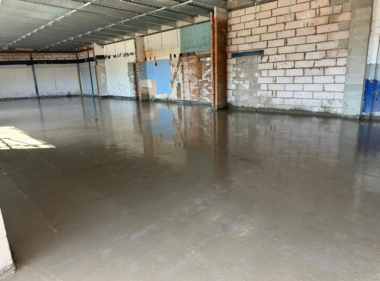 New concrete shop floor laid inside the Tesco Express in Cadishead
