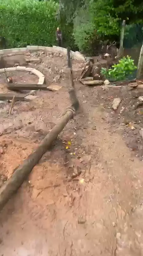 Barrow Mix pump line running through a Bramhall garden to a hard-to-reach footing