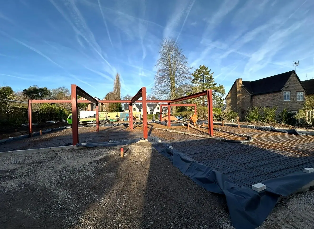 New-build site near Bowdon with steel frames, mesh and membrane ready for concrete