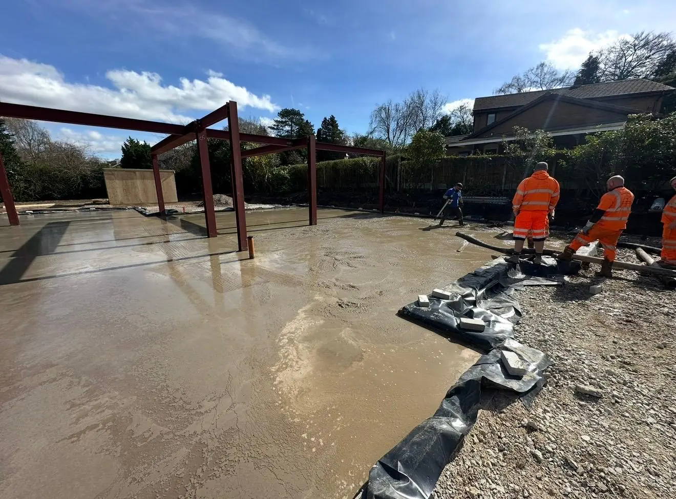 Crew finishing the floated concrete slab on the new build near Bowdon