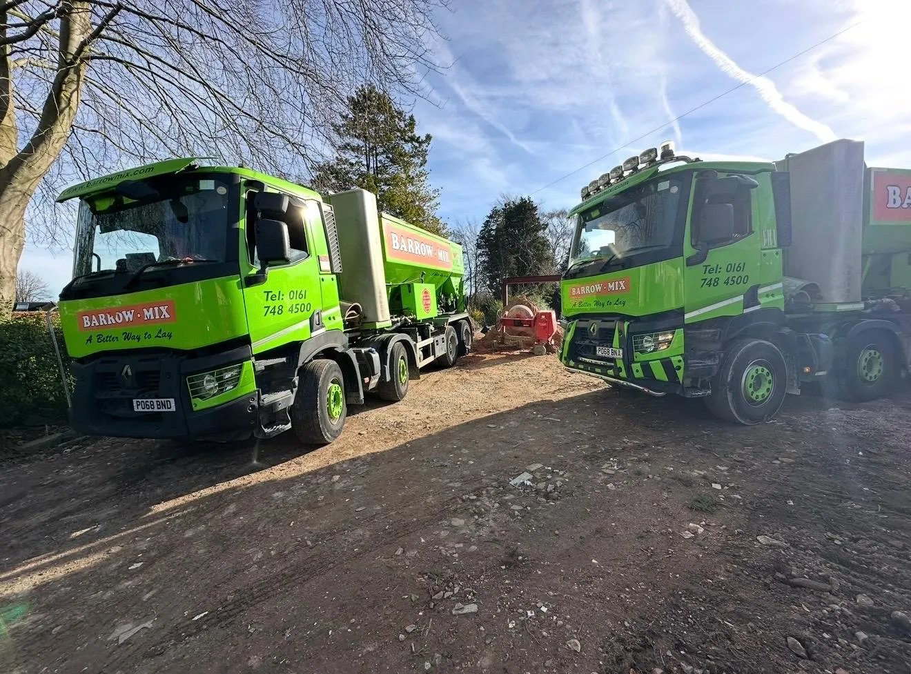 Two Barrow Mix wagons parked up on the new-build site near Bowdon