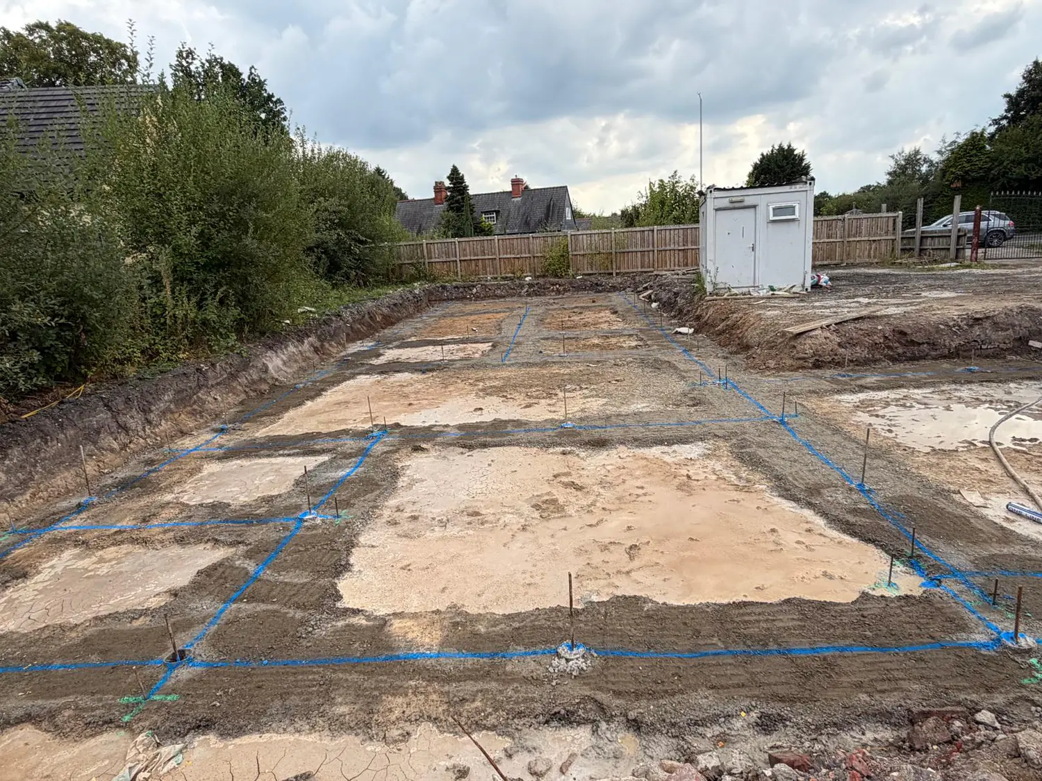 Wide view of the new-build plot in Bramhall ready for the oversite pour