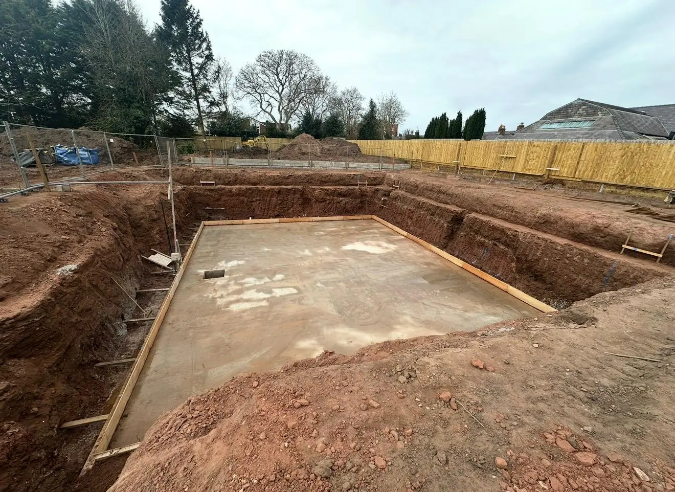 Finished concrete base for the first stage of a swimming pool, in a dug-out site in Sale